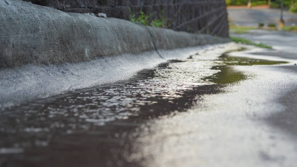 proper grading shows rain water flowing away from the property