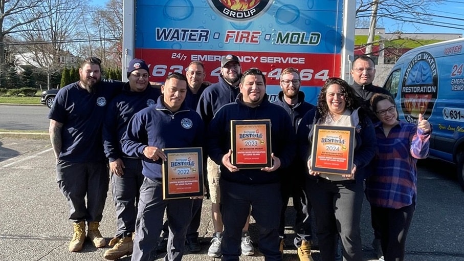 United Water Restoration Toronto team with Best of LI winners plaques