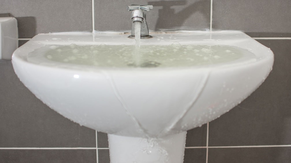 Sink overflowing with water